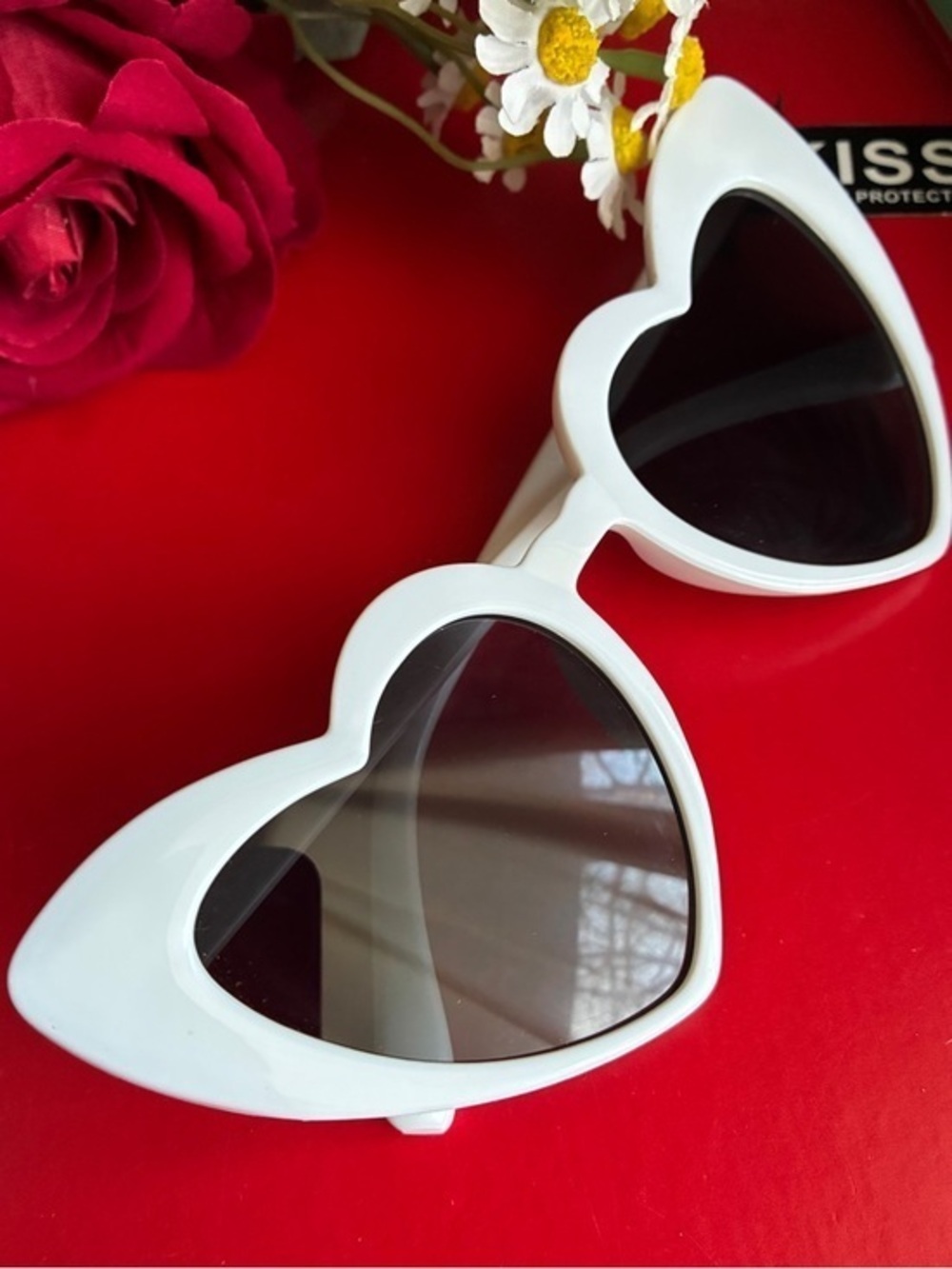 Kiss White Heart-Shaped Sunglasses with Dark Lenses 100% UV protection.